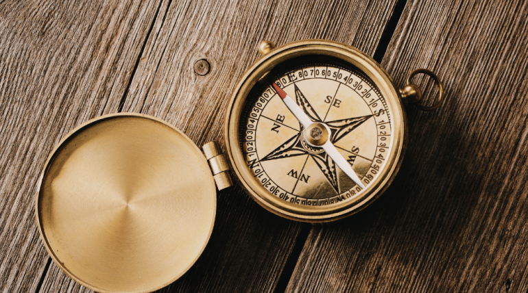 vintage compass on a natural surface