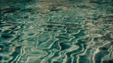 Gentle ripples in still water, symbolizing quiet, continuous movement and steady practice