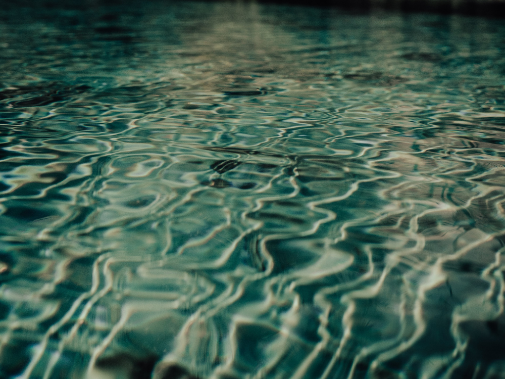 Gentle ripples in still water, symbolizing quiet, continuous movement and steady practice